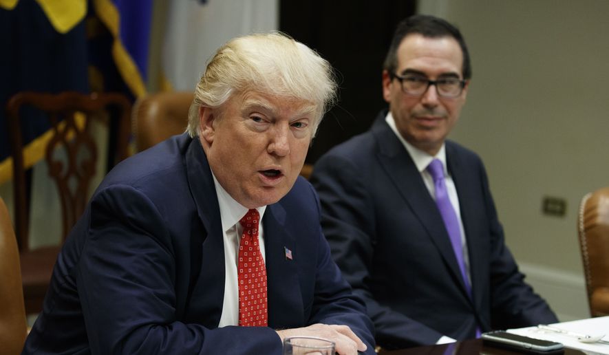 Treasury Secretary Steven Mnuchin listens at right as President Donald Trump speaks during a meeting on the federal budget, Wednesday, Feb. 22, 2017, in the Roosevelt Room of the White House in Washington. (AP Photo/Evan Vucci)