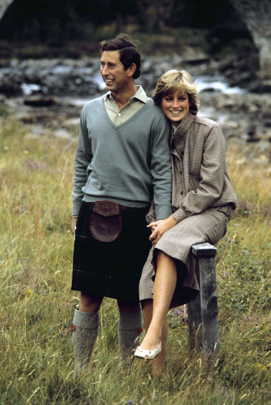 FILE - In this Aug. 19, 1981 file photo, Britain&#39;s Prince Charles and Diana, Princess of Wales pose for photographers during their honeymoon in Balmoral, Scotland. This outfit is featured in an exhibition of 25 dresses and outfits worn by Diana entitled &amp;quot;Diana: Her Fashion Story&amp;quot; at Kensington Palace in London, opening on Friday, Feb. 24, 2017. (PA via AP, file)