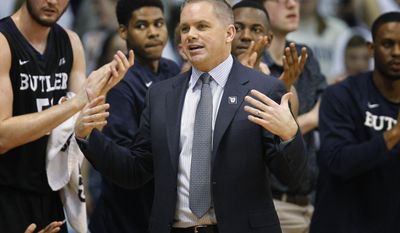 Butler coach Chris Holtmann stands in front of players on the bench during the first half of the team&#x27;s NCAA college basketball game against Villanova, Wednesday, Feb. 22, 2017, in Villanova, Pa. (AP Photo/Laurence Kesterson)