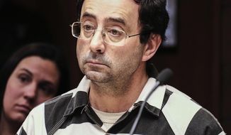FILE - In this Friday, Feb. 17, 2017, file photo, Dr. Larry Nassar listens to testimony of a witness during a preliminary hearing, in Lansing, Mich. The former sports doctor at Michigan State University who specialized in treating gymnasts has been charged with sexual assault. Dr. Nassar was charged Wednesday, Feb. 22,  in two Michigan counties. Online records show he&#x27;s facing nine charges in Ingham county, including first-degree criminal sexual conduct against a victim under age 13. Nassar had a clinic at Michigan State, where he treated members of the gymnastics team and younger regional gymnasts. (Robert Killips/Lansing State Journal via AP, File)