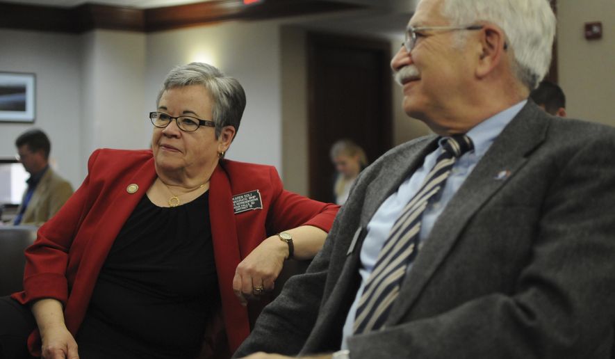 Democratic Rep. Karen Soli, left, sits in a committee hearing at the state Capitol in Pierre, S.D., on Wednesday, Feb. 22, 2017. Soli is sponsoring a bill that would create a state government watchdog board. (AP Photo/James Nord)