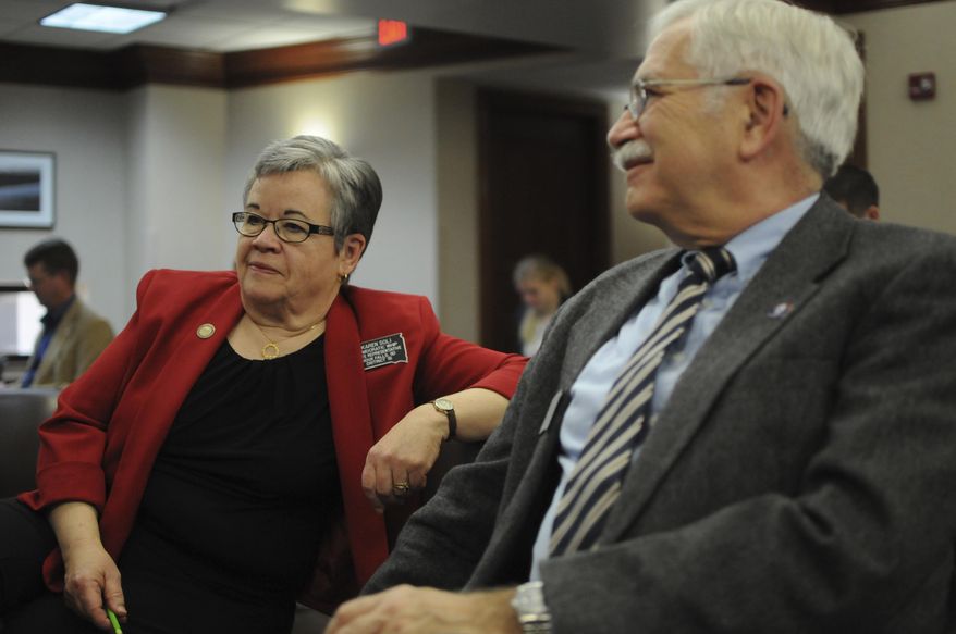 Democratic Rep. Karen Soli, left, sits in a committee hearing at the state Capitol in Pierre, S.D., on Wednesday, Feb. 22, 2017. Soli is sponsoring a bill that would create a state government watchdog board. (AP Photo/James Nord)