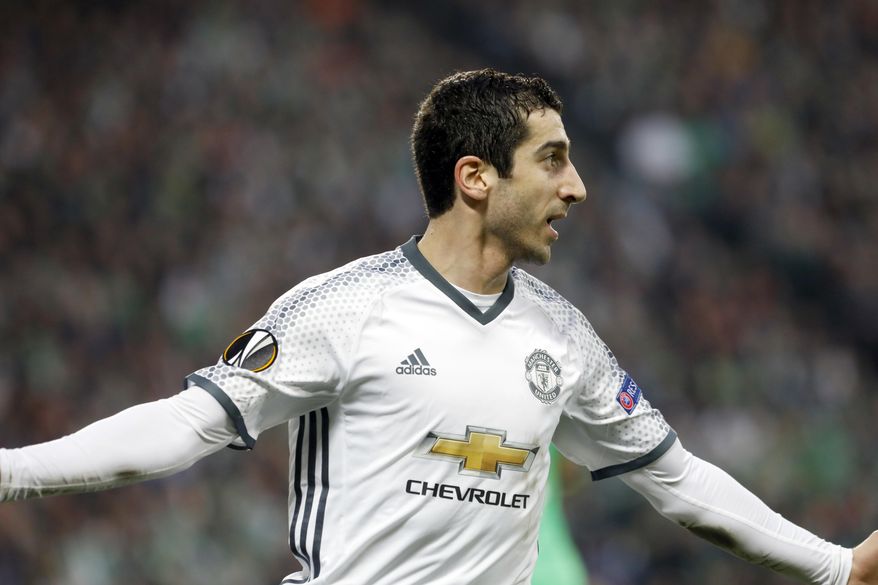 Manchester United's Henrikh Mkhitaryan celebrates after scoring the opening goal during a Europa League round of 32 second leg soccer match between Saint Etienne and Manchester United at Geoffroy Guichard stadium in Saint Etienne, France, Wednesday, Feb. 22, 2017. (AP Photo/Laurent Cipriani)