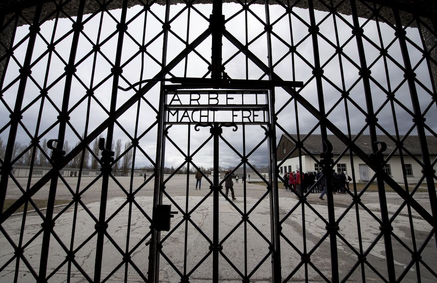 A copy of the historic gate of the memorial site of the former concentration camp Dachau is photographed in Dachau, Germany, Wednesday Feb. 22, 2017. (Sven Hoppe/dpa via AP)