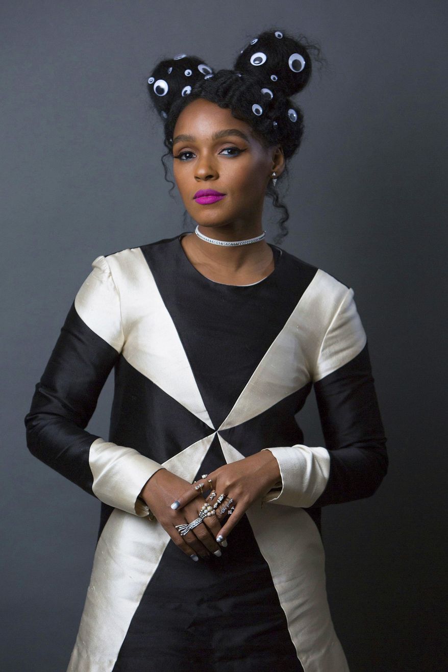 This Dec. 20, 2016 photo shows singer-actress Janelle Monae, who stars in the Oscar-nominated film, "Hidden Figures," in NewYork. (Photo by Amy Sussman/Invision/AP)