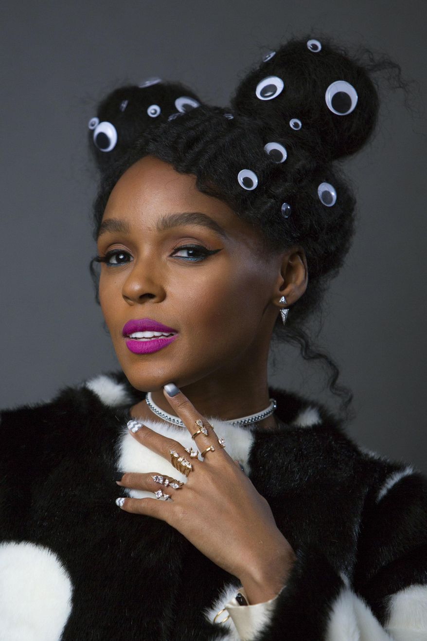This Dec. 20, 2016 photo shows singer-actress Janelle Monae, who stars in the Oscar-nominated film, "Hidden Figures," in NewYork. (Photo by Amy Sussman/Invision/AP)