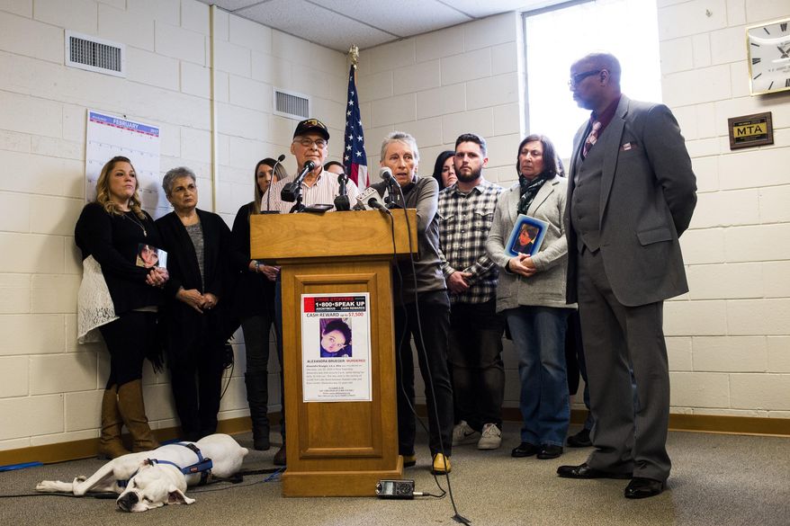 Parents Franz and Nikki Brueger speak publicly for the first time during a Crime Stoppers press conference Tuesday, Feb. 21, 2017, at the Rose Township Hall, in Mich., seeking any information or answers in the death of their daughter Alexandra Brueger, who was fatally shot four times in the back during a July 31 afternoon jog in the 11000 block of Fish Lake Road. (Jake May /The Flint Journal-MLive.com via AP)