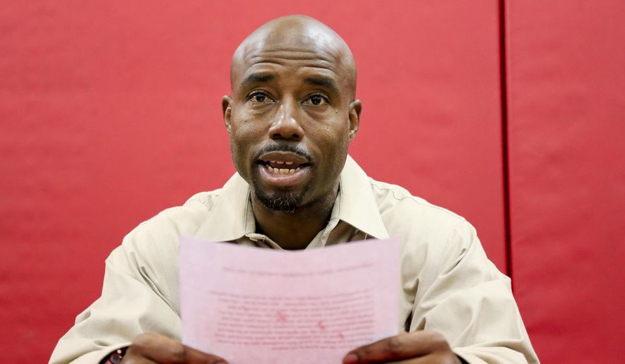 FILE- In this Aug. 19, 2016, file photo, Nebraska receivers coach Keith Williams reads a statement about his drunken driving arrest and suspension from coaching duties during an NCAA college football news conference at Hawks Championship Center in Lincoln, Neb. On Wednesday, Feb. 22, 2017, Williams was sentenced to 30 days in jail and fined $1,000 after pleading no contest to third-degree drunken driving. Williams is to report to jail on March 3, but a Lancaster County judge said Williams could apply for house arrest. Williams was arrested after rear-ending a vehicle in August, and Cornhuskers coach Mike Riley suspended him for the first four games of the 2016 season. (AP Photo/Nati Harnik, file)