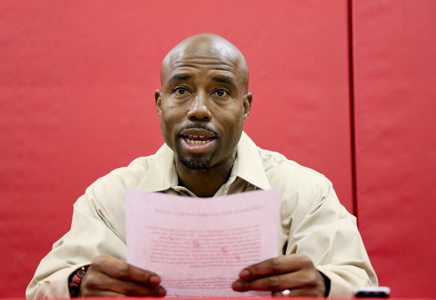 FILE- In this Aug. 19, 2016, file photo, Nebraska receivers coach Keith Williams reads a statement about his drunken driving arrest and suspension from coaching duties during an NCAA college football news conference at Hawks Championship Center in Lincoln, Neb. On Wednesday, Feb. 22, 2017, Williams was sentenced to 30 days in jail and fined $1,000 after pleading no contest to third-degree drunken driving. Williams is to report to jail on March 3, but a Lancaster County judge said Williams could apply for house arrest. Williams was arrested after rear-ending a vehicle in August, and Cornhuskers coach Mike Riley suspended him for the first four games of the 2016 season. (AP Photo/Nati Harnik, file)