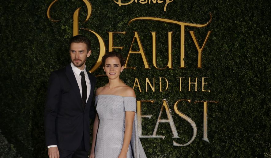 Dan Stevens, left and Emma Watson arrive for the Beauty And The Beast Premiere, in London, Thursday, Feb. 23, 2017. (AP Photo/Alastair Grant)