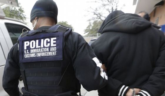 Under a proposed agreement, sheriffs would be acting on behalf of U.S. Immigration and Customs Enforcement, which would pay to have detainees kept until federal officers can get them. (Associated Press/File)