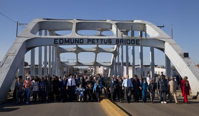 FILE - In this March 7, 2015, file photo, President Barack Obama, first lady Michelle Obama, their daughters Malia and Sasha, as well as members of Congress, former President George W. Bush, and civil rights leaders make a symbolic walk across the Edmund Pettus Bridge in Selma, Ala., on the 50th anniversary of &amp;quot;Bloody Sunday,&amp;quot; a civil rights march in which protestors were beaten, trampled and tear-gassed by police at the site. Blacks who celebrate the civil rights movement and whites who commemorate the Civil War are suddenly finding themselves fighting on the same side in historic Selma, Alabama: against City Hall. (AP Photo/Jacquelyn Martin, File)