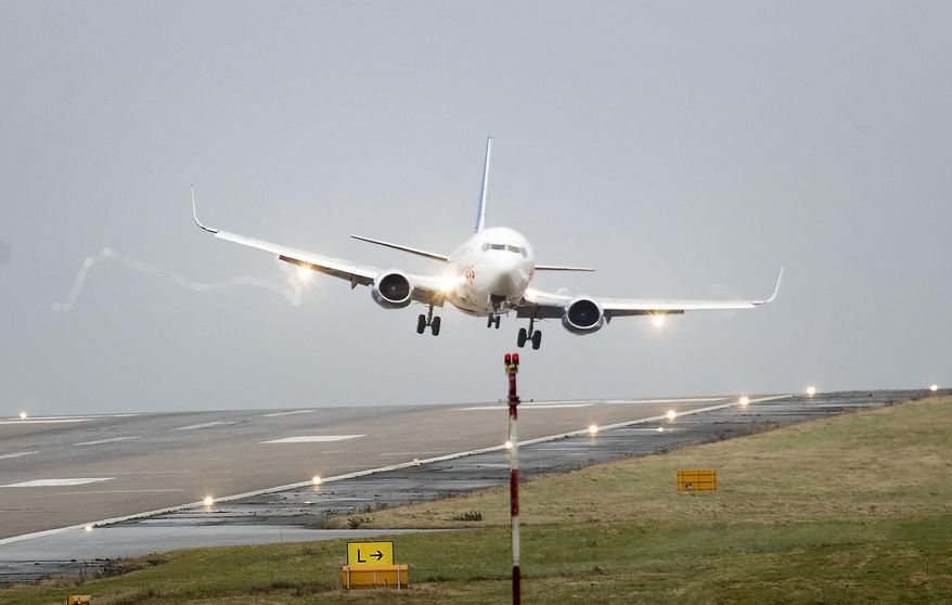 A plane is buffeted by the wind as it comes in to land at Leeds Bradford Airport as as flights were cancelled and commuters were warned they faced delays as winds reached nearly 90mph when Storm Doris battered many part of Britain. Thursday Feb. 23, 2017. (Danny Lawson/PA via AP)