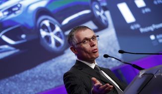 PSA Peugeot Citroen Chief Executive Carlos Tavares delivers his speech during the presentation of the company&#39;s 2016 full year results, in Paris, Thursday, Feb.23, 2017. French carmaker PSA Group saw its profits jump last year and is giving dividends for the first time since 2011, burnishing its image as it weighs a buyout of General Motors&#39; money-losing European operations. (AP Photo/Christophe Ena)