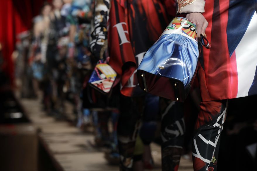 Models wear creations part of the Moschino women's Fall-Winter 2017-18 collection, that was presented in Milan, Italy, Thursday, Feb. 23, 2017. (AP Photo/Luca Bruno).