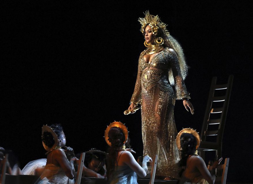 FILE - This Feb. 12, 2017 file photo shows Beyonce performing at the 59th annual Grammy Awards in Los Angeles. Beyonce, who is pregnant with twins, will not perform at Coachella this year, but will headline the festival in 2018. In a joint statement released Thursday, Feb. 23, Beyonce’s Parkwood Entertainment and festival producer Goldenvoice said the pop star had to pull out of the famed festival under doctor’s orders. (Photo by Matt Sayles/Invision/AP, File)