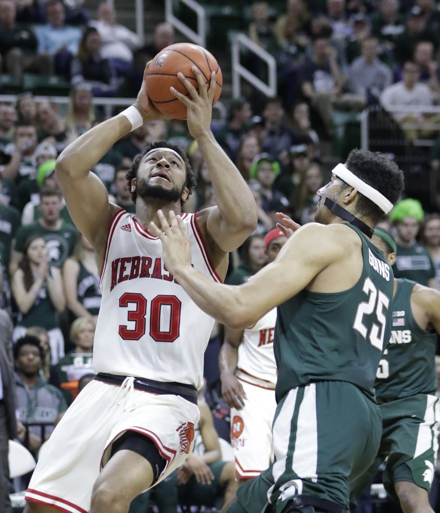 Nebraska forward Ed Morrow (30) makes a layup while defended by Michigan State forward Kenny Goins (25) during the first half of an NCAA college basketball game, Thursday, Feb. 23, 2017, in East Lansing, Mich. (AP Photo/Carlos Osorio)