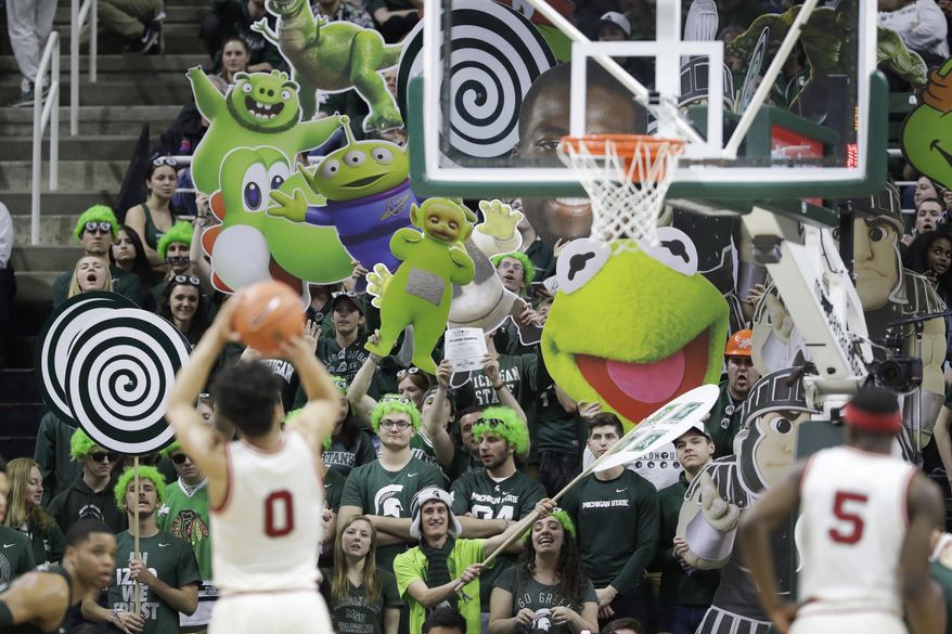 Michigan State fans try to distract Nebraska guard Tai Webster (0) on a free throw during the second half of an NCAA college basketball game, Thursday, Feb. 23, 2017, in East Lansing, Mich. (AP Photo/Carlos Osorio)