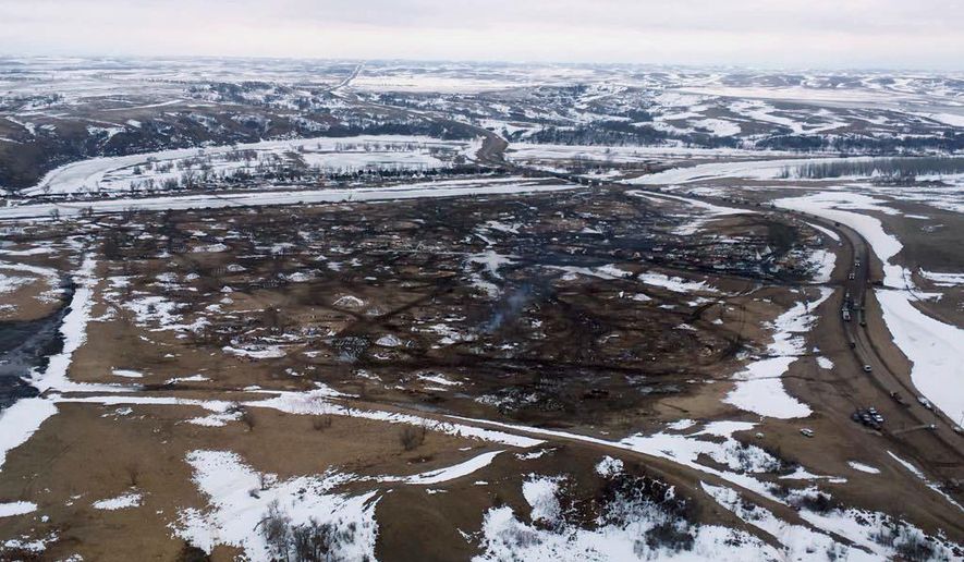 This aerial photo provided the Morton County Sheriff Department shows the closed Dakota Access pipeline protest camp near Cannon Ball, N.D., Thursday, Feb. 23, 2017.  Authorities on Thursday cleared the camp where opponents of the pipeline had gathered for the better part of a year, searching tents and huts and arresting dozens of holdouts who had defied a government order to leave. (Morton County Sheriff Department via AP)