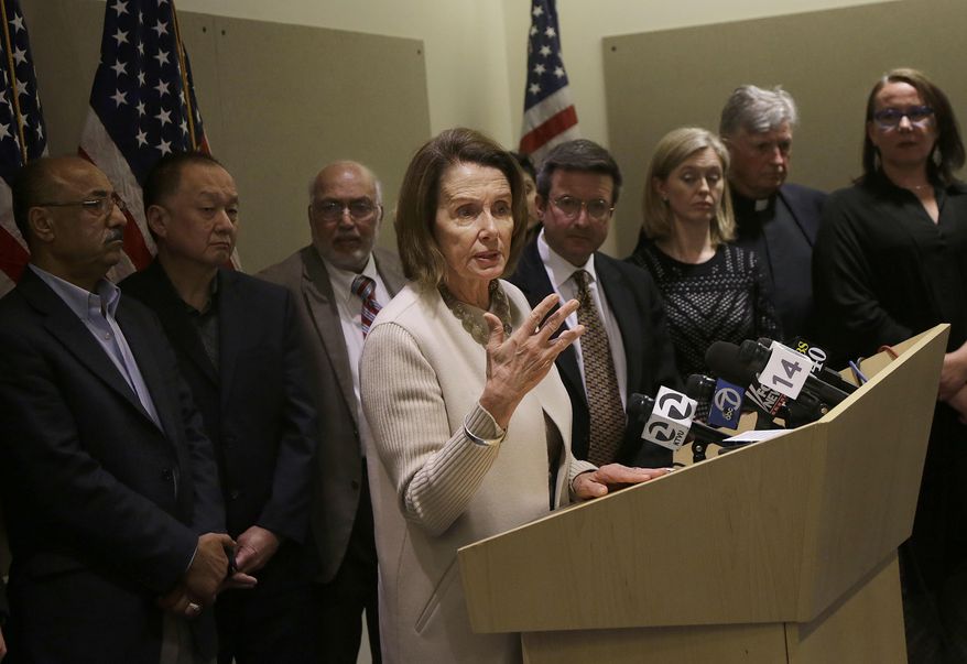 House Minority Leader Nancy Pelosi of Calif., center, speaks a news conference after participating in a roundtable discussion about President Donald Trump's immigration and refugee policies in San Francisco, Thursday, Feb. 23, 2017. (AP Photo/Jeff Chiu)