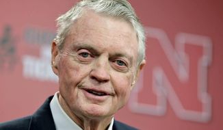 FILE- In this Sept. 26, 2012, file photo, Tom Osborne jokes about his health as he announces his retirement from his post of athletic director, during a news conference in Lincoln, Neb. Osborne turned 80 on Thursday, Feb. 23, 2017. It&#39;s going on 20 years since he last coached a football game and 10 years since the end of his three terms as a Nebraska congressman. He was Nebraska&#39;s athletic director from 2007-12, served two years on the College Football Playoff committee and continues to work as many as 50 hours a week with the teen mentoring program he started with his wife in 1991. (AP Photo/Nati Harnik, File)