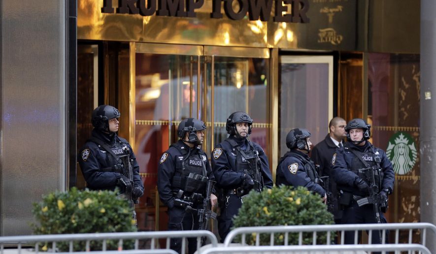 New York City Police stand guard outside Trump Tower in New York, in this Nov. 18, 2016, file photo. (AP Photo/Richard Drew, File)