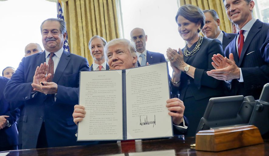 President Trump signed an executive order as one of his first moves in the White House that directed agencies to repeal two regulations for every rule enacted. (Associated Press/File)