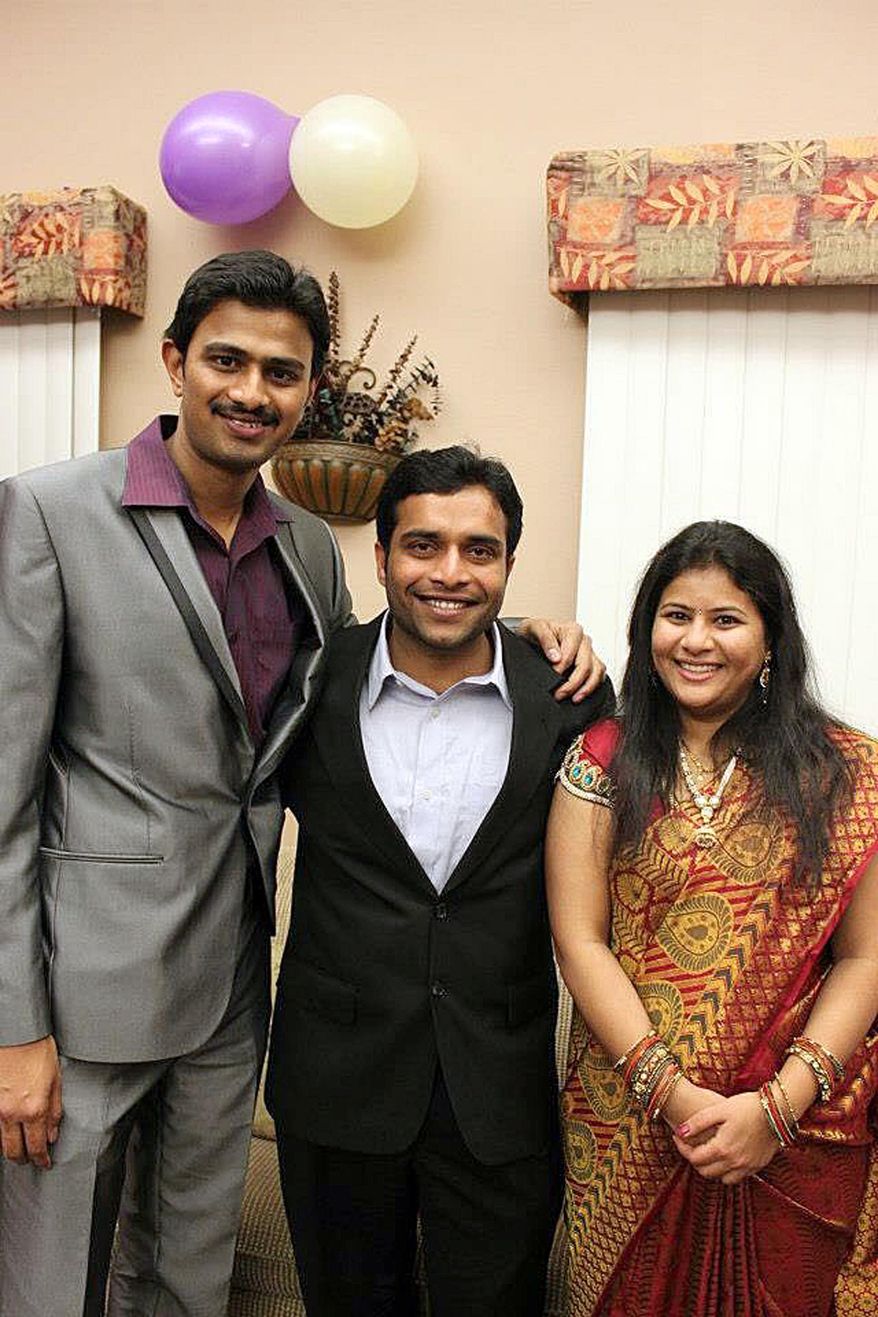 In this undated photo provided by Kranti Shalia, Srinivas Kuchibhotla, left, poses for photo with Alok Madasani and his wife Sunayana Dumala in Cedar Rapids, Iowa. In the middle of a crowded bar, a 51-year-old former air traffic controller yelled at two Indian men - Kuchibhotla and Madasani - to "get out of my country," witnesses said, then opened fire in an attack that killed one of the men and wounded the other, as well as a third man who tried to help, Thursday, Feb 23, 2017, in Olathe, Kan. (Kranti Shalia via AP)