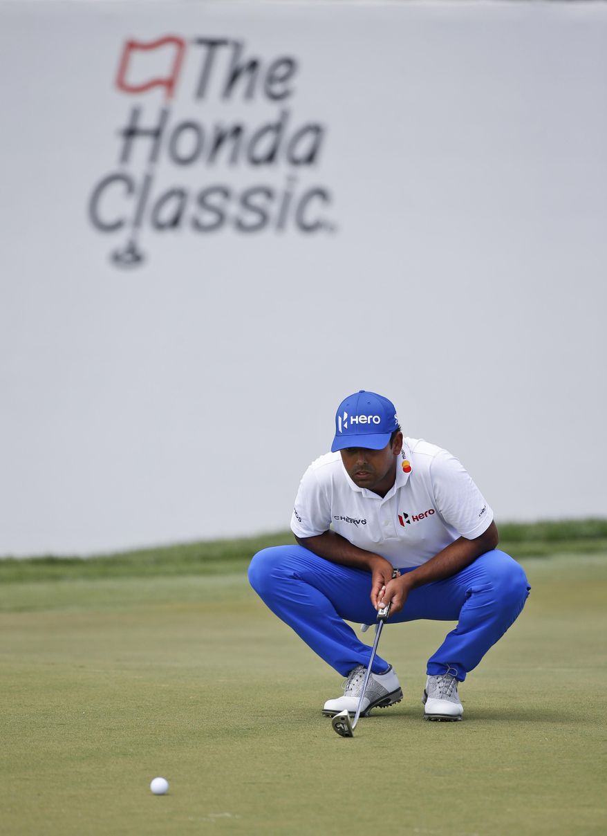 Anirban Lahiri, of India, lines up a putt on the ninth hole during the second round of the Honda Classic golf tournament, Friday, Feb. 24, 2017, in Palm Beach Gardens, Fla. (AP Photo/Wilfredo Lee)