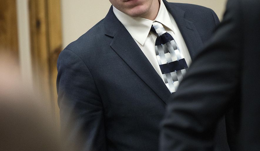 John R.K. Howard takes a seat during his sentencing hearing, Friday, Feb. 24, 2017, at the courthouse in Twin Falls, Idaho. District Judge Randy Stoker has sentenced John R.K. Howard, a high school football player to three years of probation and 300 hours of community service after prosecutors said he took part in a brutal locker room assault on a black football player in a small Idaho town. (Drew Nash/The Times-News via AP)