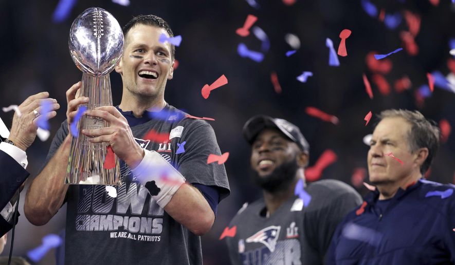 FILE - In this Feb. 5, 2017, file photo, New England Patriots&#x27; Tom Brady holds the Vince Lombardi Trophy beside coach Bill Belichick, right, after the Patriots defeated the Atlanta Falcons 34-28 in overtime at the NFL Super Bowl 51 football game in Houston.  A new book and a movie are in the works about Brady and the suspension he overcame to earn an unprecedented fifth Super Bowl ring. (AP Photo/Darron Cummings, File)