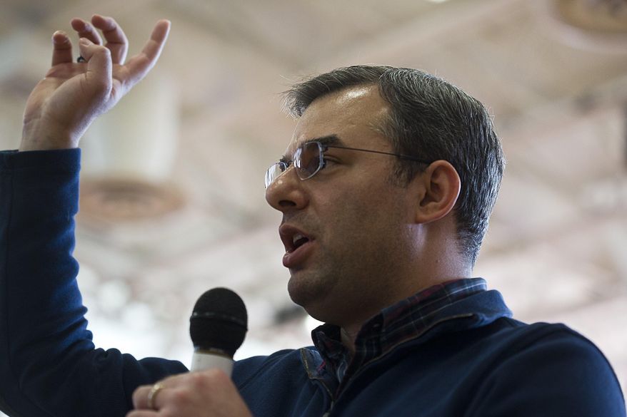 U.S Rep. Justin Amash, R-Cascade Township, speaks to the audience during a town hall meeting on Thursday, Feb. 23, 2017 at the Full Blast Recreation Center in Battle Creek, Mich. (Carly Geraci/Kalamazoo Gazette-MLive Media Group via AP)