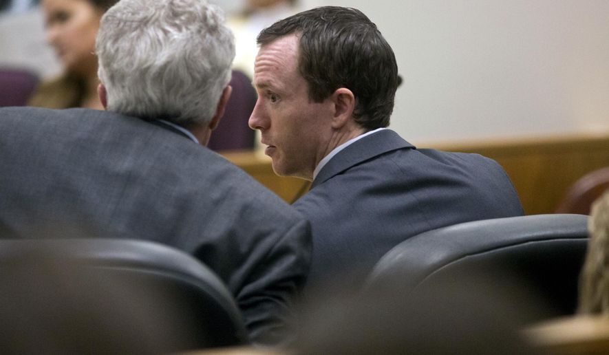 Conrad Truman, right, speaks with Mark Moffatt, his defense attorney, during the closing arguments in his murder trial Thursday, Feb. 23, 2017, in Provo, Utah. A jury has begun deliberating in the case of Truman, a Utah man on trial for the second time in his wife's death. (Sammy Jo Hester/The Daily Herald via AP, Pool)