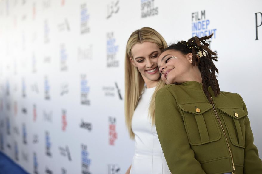 Riley Keough, left, and Sasha Lane arrive at the Film Independent Spirit Awards on Saturday, Feb. 25, 2017, in Santa Monica, Calif. (Photo by Jordan Strauss/Invision/AP)