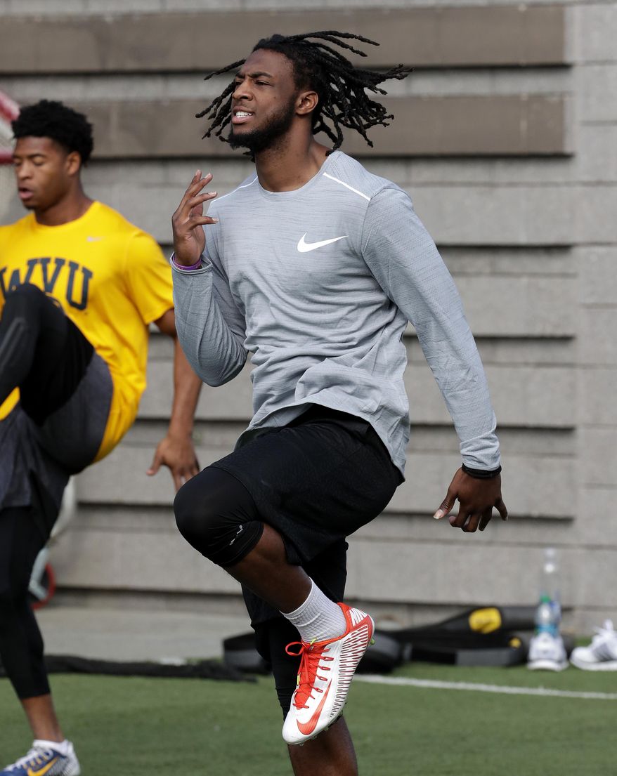 Former Clemson receiver Mike Williams runs drills, Monday, Feb. 13, 2017, in Phoenix during a football workout for the upcoming NFL combine. (AP Photo/Matt York)