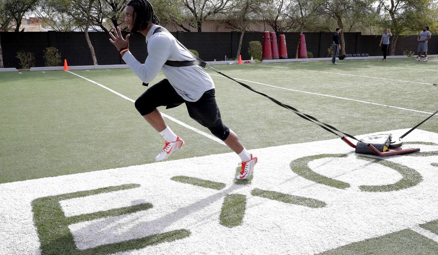 Former Clemson receiver Mike Williams runs drills, Monday, Feb. 13, 2017, in Phoenix during a football workout for the upcoming NFL combine. (AP Photo/Matt York)