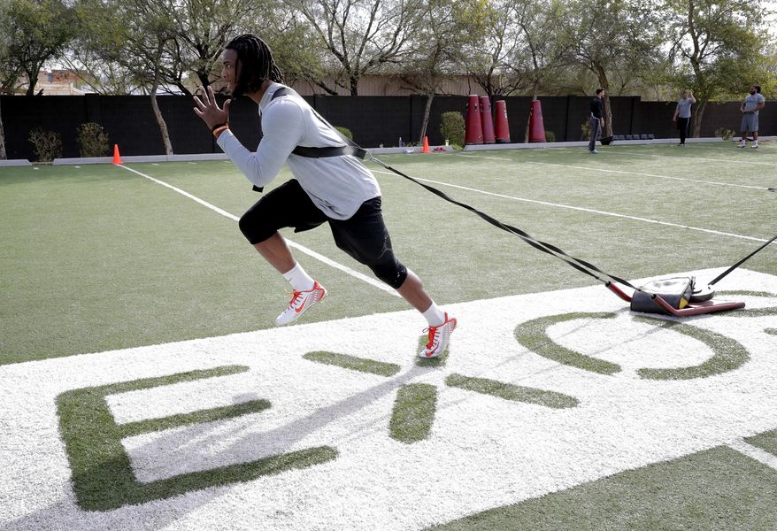 Former Clemson receiver Mike Williams runs drills, Monday, Feb. 13, 2017, in Phoenix during a football workout for the upcoming NFL combine. (AP Photo/Matt York)