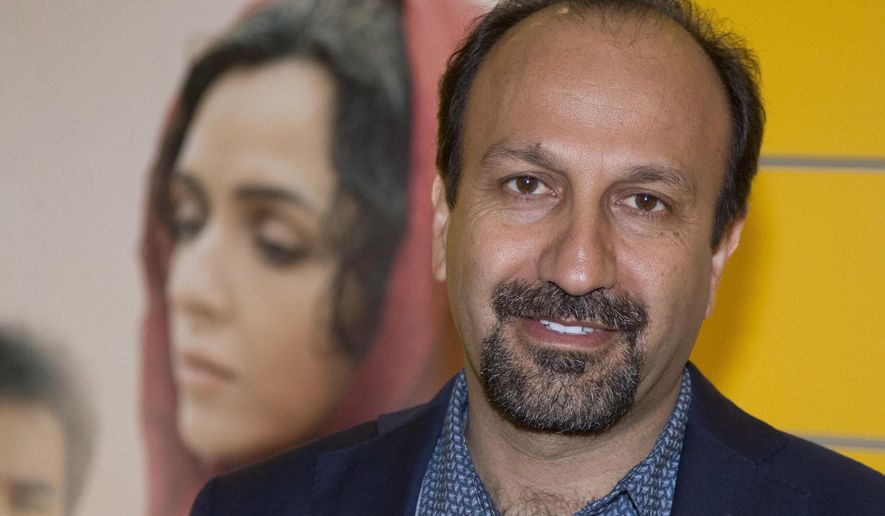 FILE - In this Oct. 10, 2016 file photo, Iranian director Asghar Farhadi poses for a photo during the premiere of his film, &amp;quot;The Salesman, in Paris.  The Oscar-nominated Iranian film director has sent a video message to a rally attended by celebrities and top talent agents to thank the Hollywood community for its support during his boycott of the awards ceremony. Last month, after U.S. President Donald Trump issued an executive order temporarily banning immigrants from seven Muslim majority countries, including Iran, Asghar Farhadi decided to boycott the Oscars. (AP Photo/Michel Euler, File)