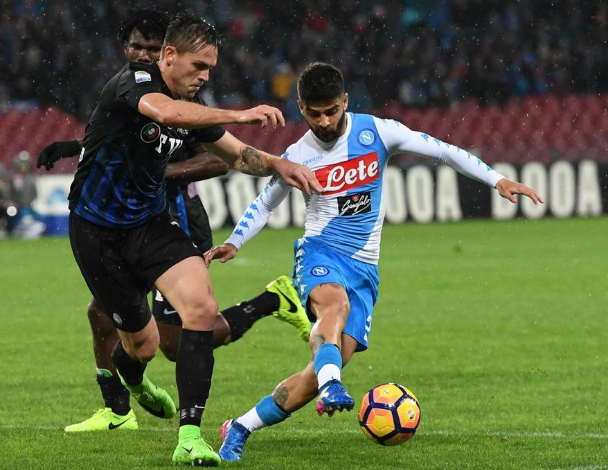 Napoli's Lorenzo Insigne, right, dribbles past a player of Atalanta during the Italian Serie A soccer match between Napoli and Atalanta at the San Paolo stadium in Naples, Italy, Saturday, Feb. 25, 2017. (Ciro Fusco/ANSA via AP)