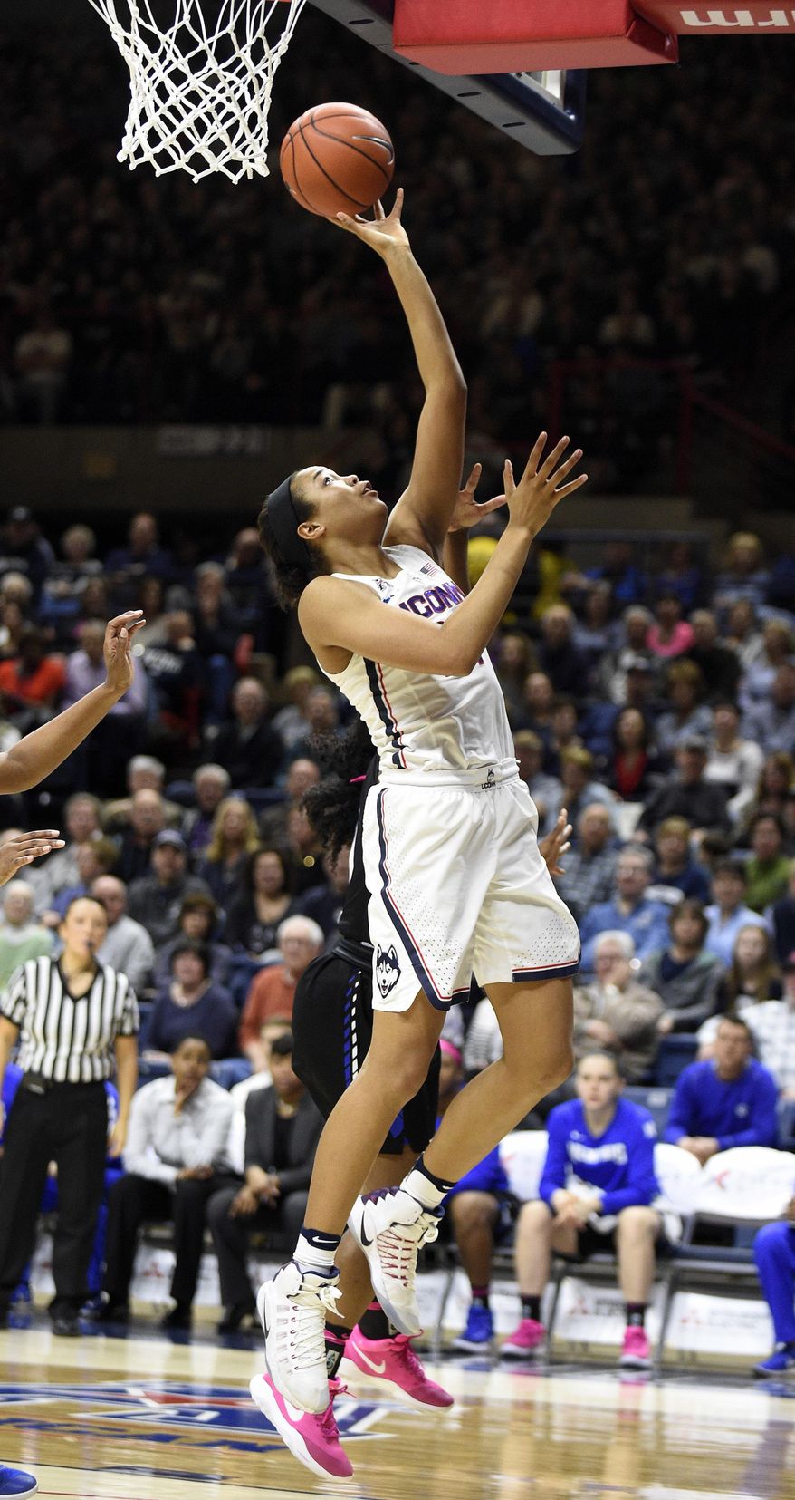 Connecticut's Napheesa Collier scores during the first half of an NCAA college basketball game against Memphis in Storrs, Conn., Saturday, Feb. 25, 2017. Connecticut won 91-48. (AP Photo/Fred Beckham)