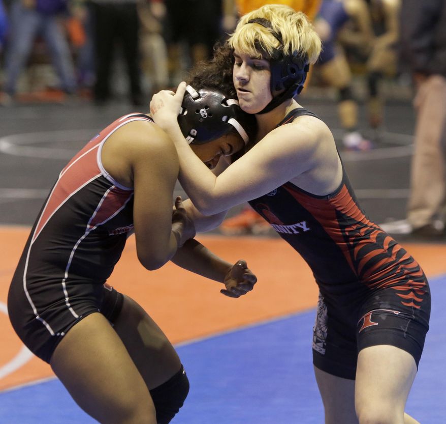Mack Beggs, right, a transgender wrestler from Euless Trinity competes in a quarterfinal against Mya Engert of Amarillo Tascosa during the state wrestling tournament Friday, Feb. 24, 2017, in Cypress, Texas. Beggs was born a female and is transitioning to male but wrestles in the girls division. (Melissa Phillip/Houston Chronicle via AP)