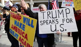 Demonstrators at Los Angeles International Airport showed support for President Trump&#39;s executive order banning travel to the U.S. from seven primarily Muslim nations. (Associated Press)