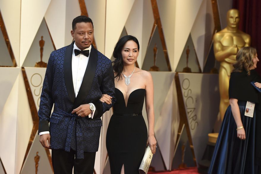 Terrence Howard, left, and Miranda Pak arrive at the Oscars on Sunday, Feb. 26, 2017, at the Dolby Theatre in Los Angeles. (Photo by Jordan Strauss/Invision/AP)