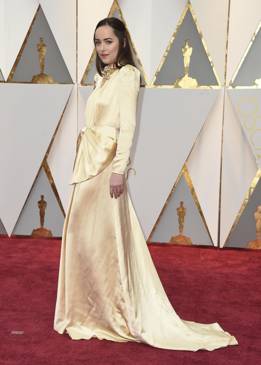 Dakota Johnson arrives at the Oscars on Sunday, Feb. 26, 2017, at the Dolby Theatre in Los Angeles. (Photo by Jordan Strauss/Invision/AP)
