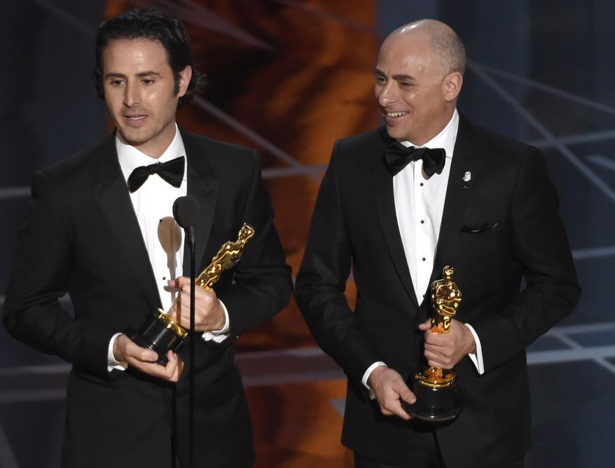 Alan Barillaro, left, and Marc Sondheimer accept the award for best animated short film for "Piper" at the Oscars on Sunday, Feb. 26, 2017, at the Dolby Theatre in Los Angeles. (Photo by Chris Pizzello/Invision/AP)