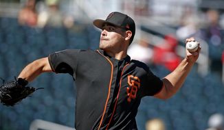 San Francisco Giants starting pitcher Matt Moore throws a pitch against the Cincinnati Reds during the first inning of a spring training baseball game, Sunday, Feb. 26, 2017, in Goodyear, Ariz. (AP Photo/Ross D. Franklin)