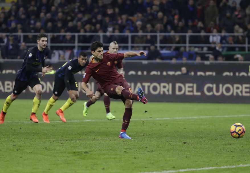 Roma's Diego Perotti scores on a penalty kick during an Italian Serie A soccer match between Inter Milan and Roma, at the San Siro stadium in Milan, Italy, Sunday, Feb. 26, 2017. (AP Photo/Luca Bruno)