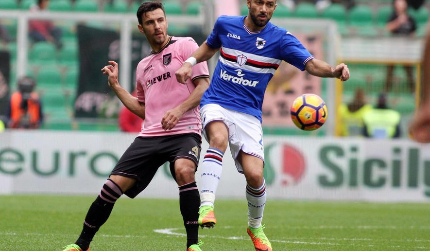 Palermo's Sinisa Andelkovic, left, and Sampdoria's Fabio Quagliarella fight for the ball during a Serie A soccer match between Palermo and Sampdoria, at the Renzo Barbera stadium in Palermo, Italy, Sunday, Feb. 26, 2017. (Corrado Lannino/ANSA via AP)