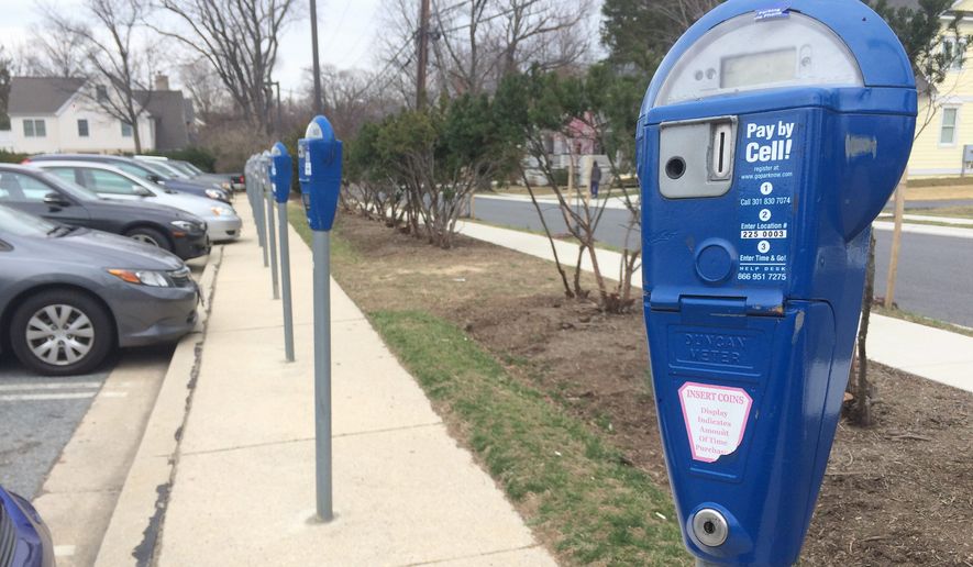 As of Monday, more than 650 people have signed a petition in support of turning four Montgomery County-owned parking lots into mixed-use recreational parks. Lot 25 in downtown Bethesda is one of four parking lots. (Photographs by Julia Brouillette/The Washington Times)