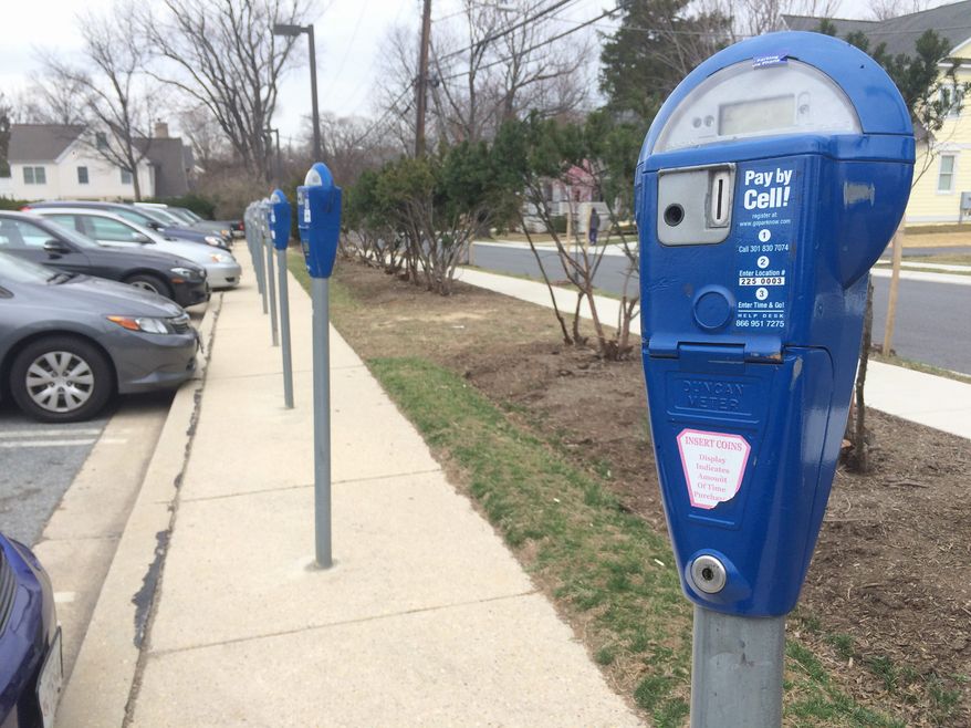 As of Monday, more than 650 people have signed a petition in support of turning four Montgomery County-owned parking lots into mixed-use recreational parks. Lot 25 in downtown Bethesda is one of four parking lots. (Photographs by Julia Brouillette/The Washington Times)